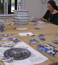 Photo with woman working on transferware