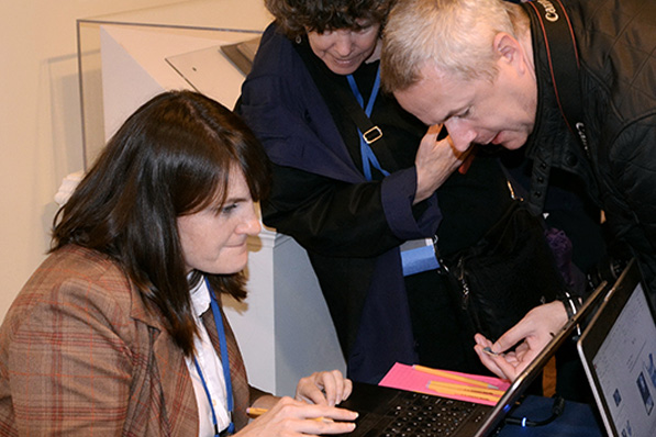 researchers looking at info on a computer